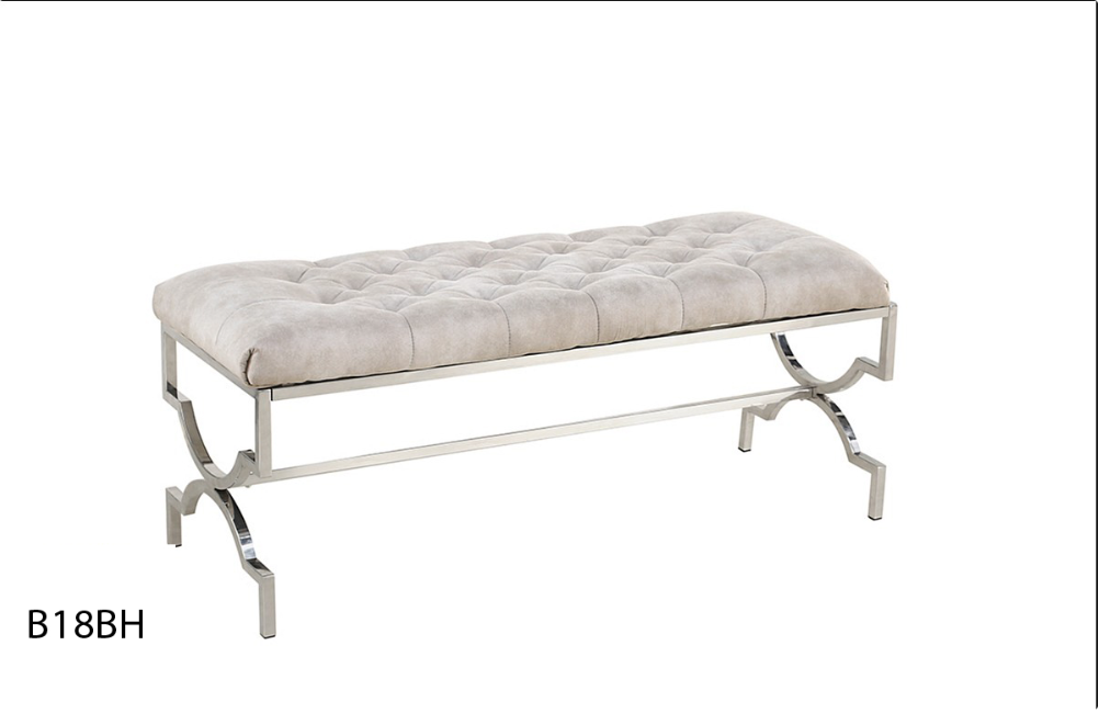A bench with a silver frame and a white cushion