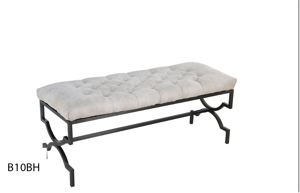 A bench with a white cushion and a black frame on a white background.