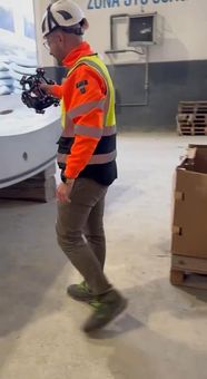 Operator inspecting a precast element with optical 3D equipment