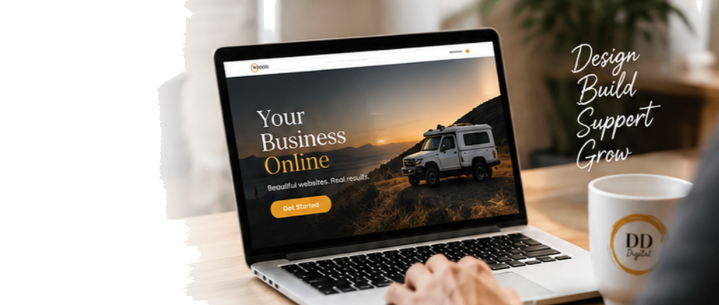 Laptop showing a business website, with a coffee cup and handwritten “Design, Build, Support, Grow” notes beside it