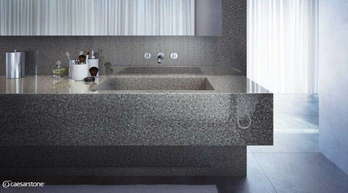 A bathroom with two sinks and a mirror.