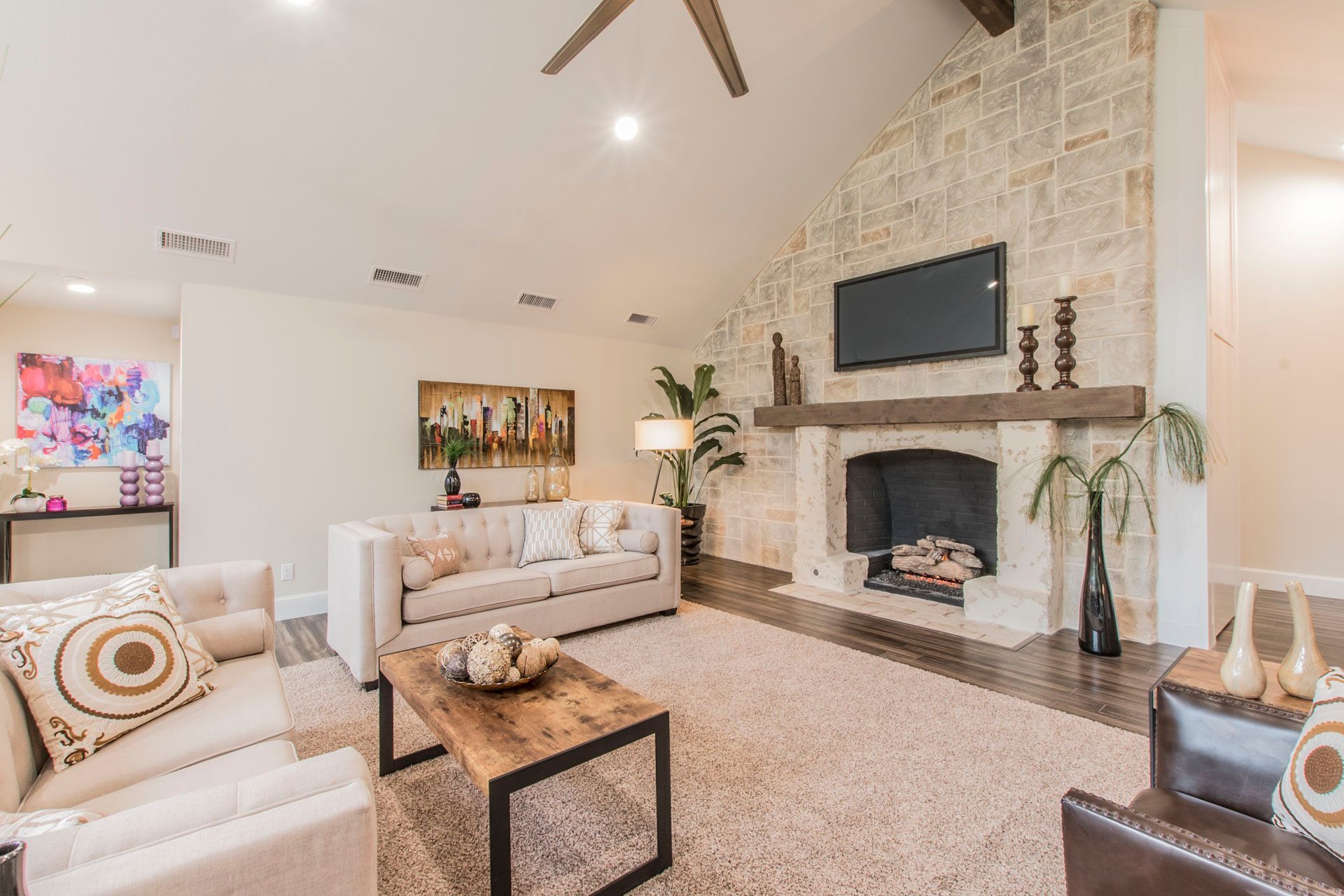 Elegant living room featuring a beautifully renovated fireplace by Night 'N' Day Construction during a total home remodel in Dallas, TX.