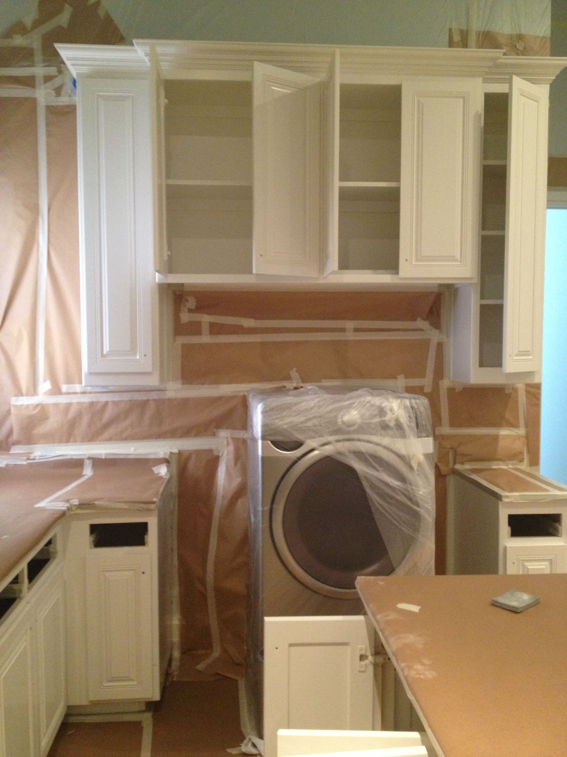 Night 'N' Day Construction tarping the interior of a home in Flowermound, Tx, preparing for a  renovation as part of an insurance claim