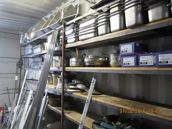 A picture of a storage room with steel pans.