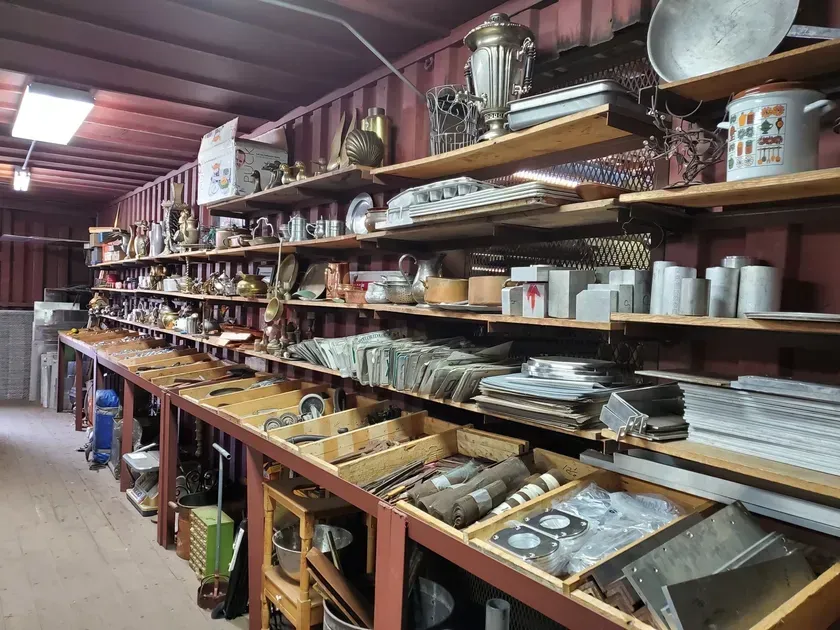 A room filled with shelves filled with lots of items.