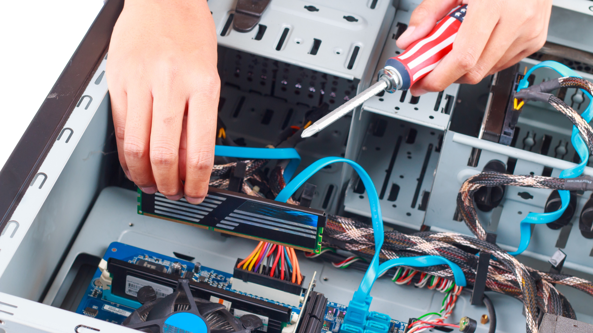 technician with screw driver in hand installing ram during repairs & hardware upgrades