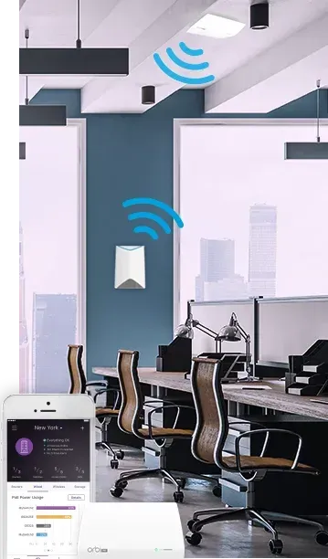 Wall-mounted wireless access point providing Wi-Fi coverage in a modern office workspace