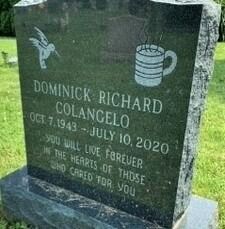 Black granite gravestone with dove and beer mug engravings for Dominick Richard Colangelo, 1943–2020.