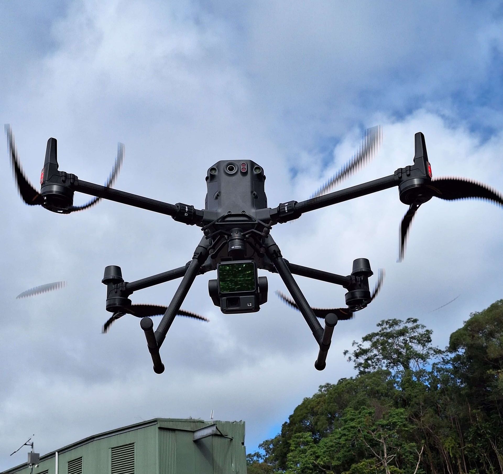 A Drone is Flying Over a Dam— Tailored Spatial Solutions in Cairns City, QLD
