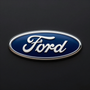 Ford logo on a dark background, blue oval with white script and silver border