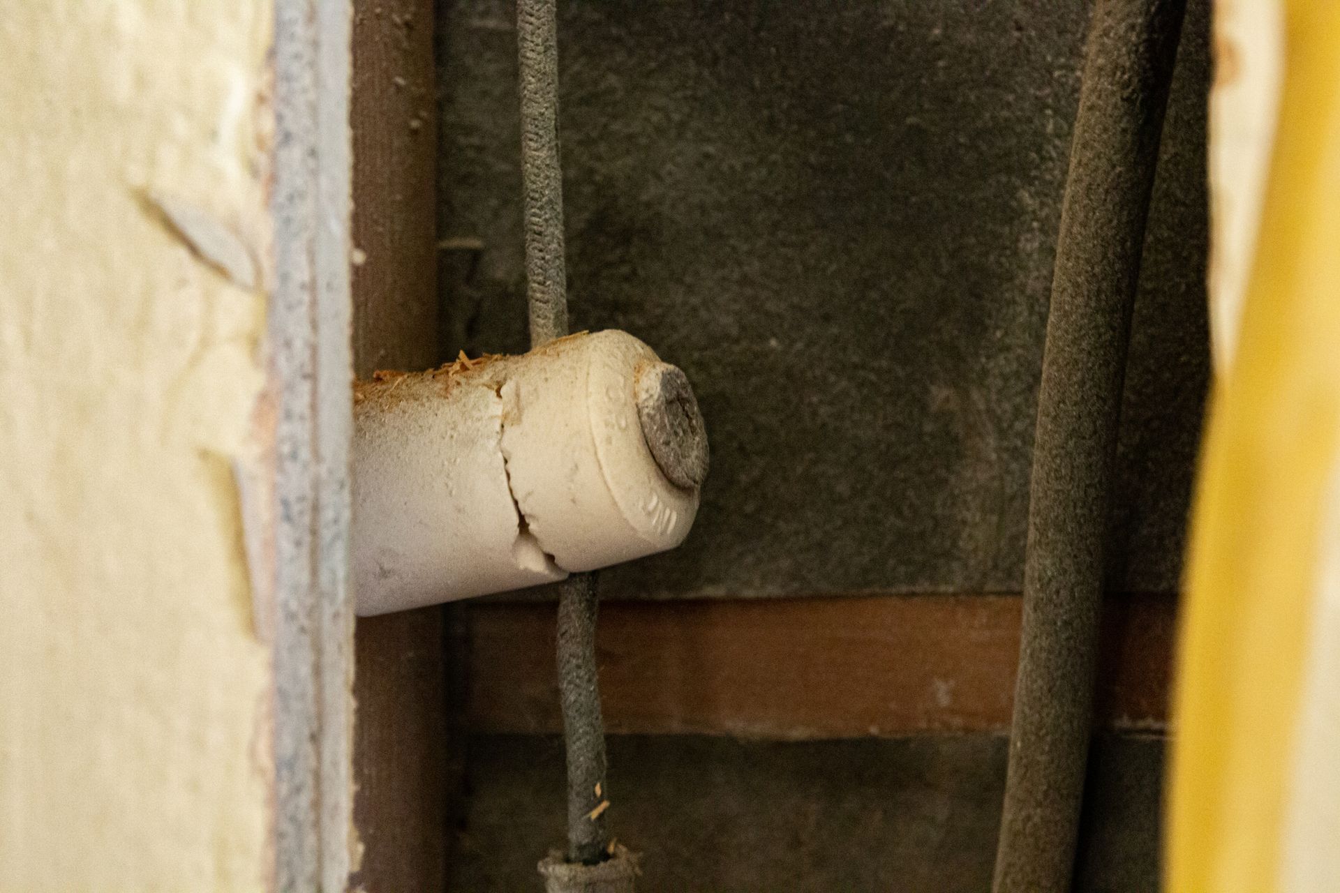 Old knob and tube wiring with ceramic insulators inside a historic home.