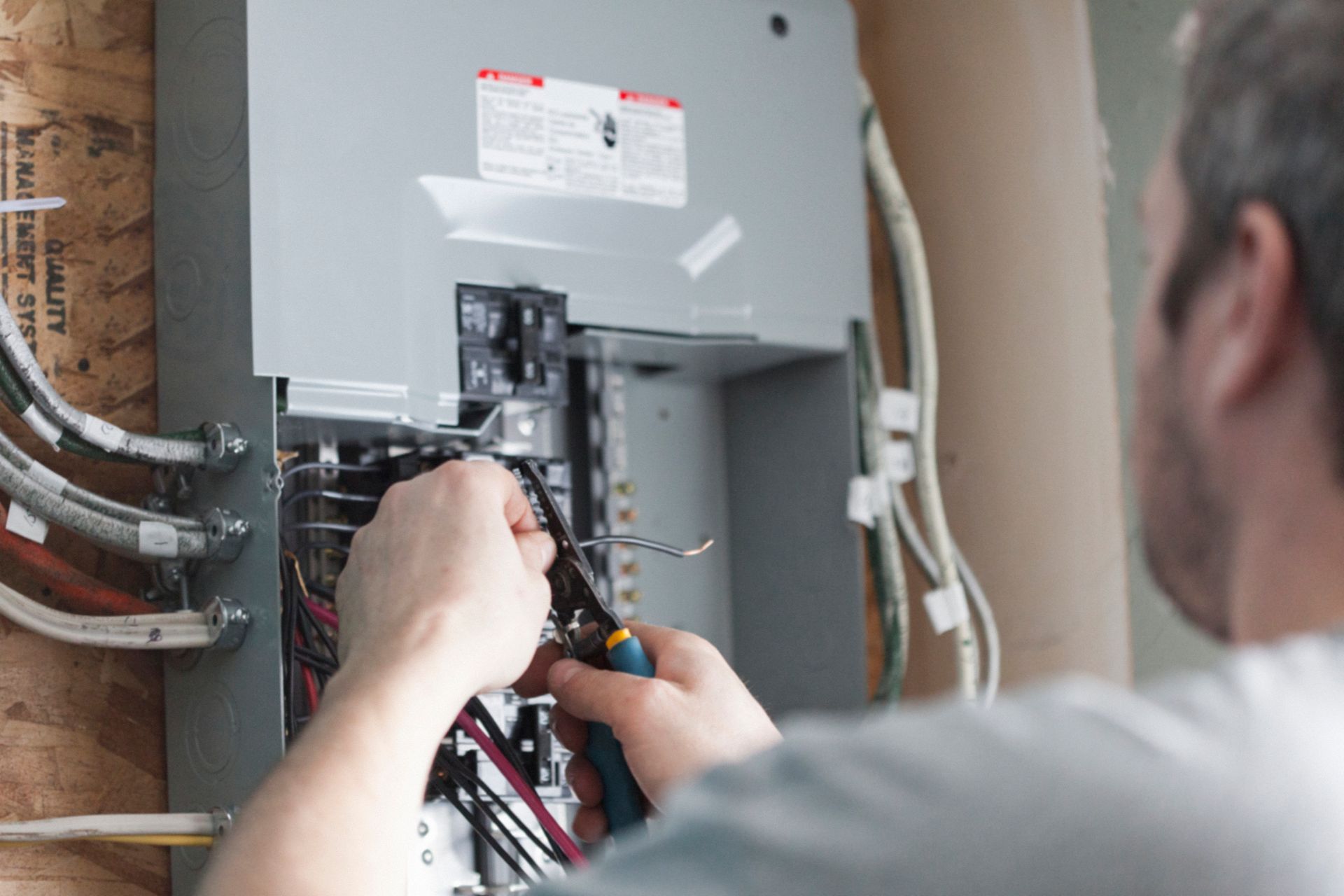 Licensed electrician inspecting residential electrical system for safety in Montclair, New Jersey.