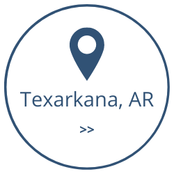 Blue location pin above “Texarkana, AR” inside a blue outlined circle with double chevrons below.