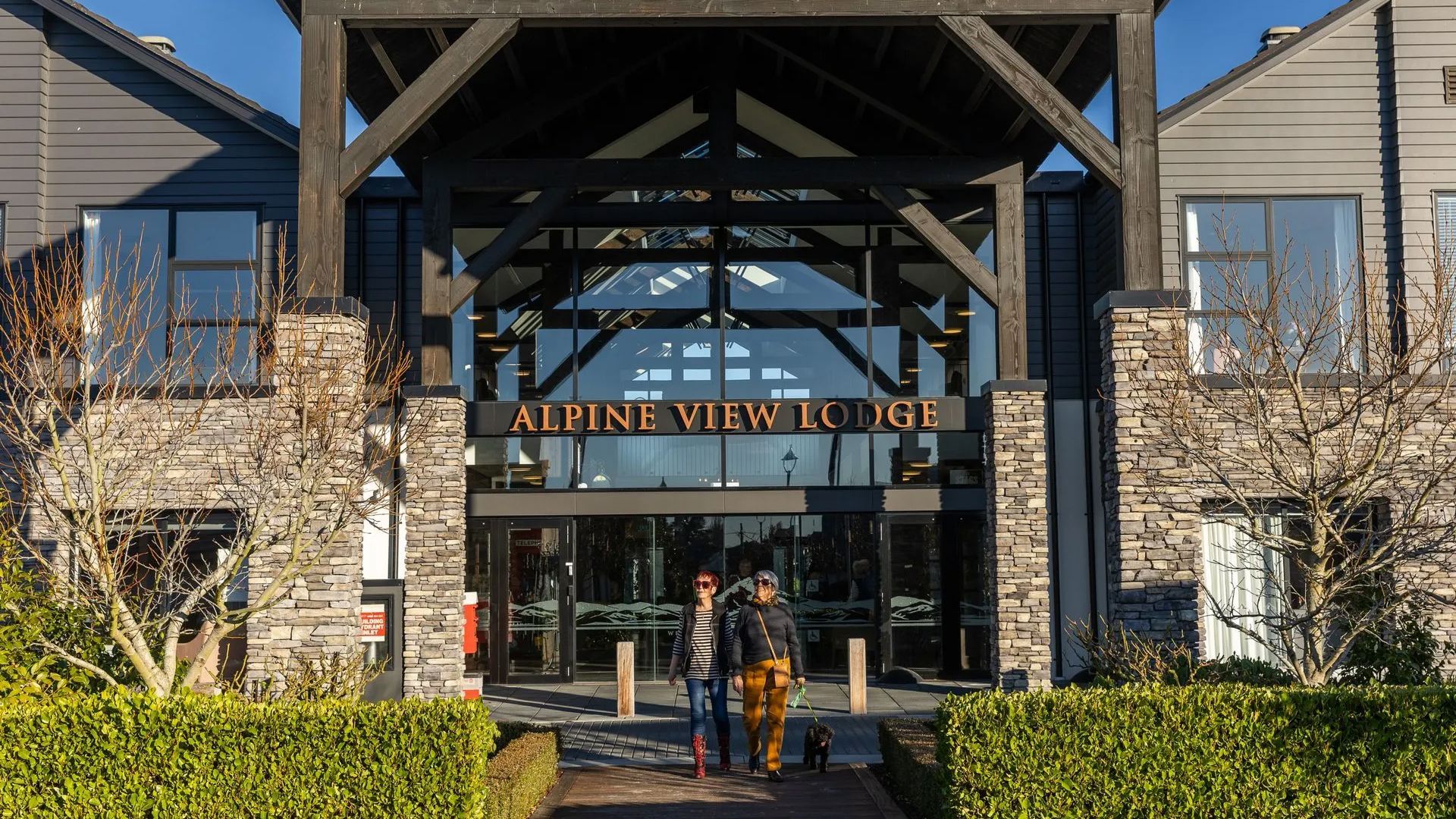 Alpine View Lodge entrance with residents walking