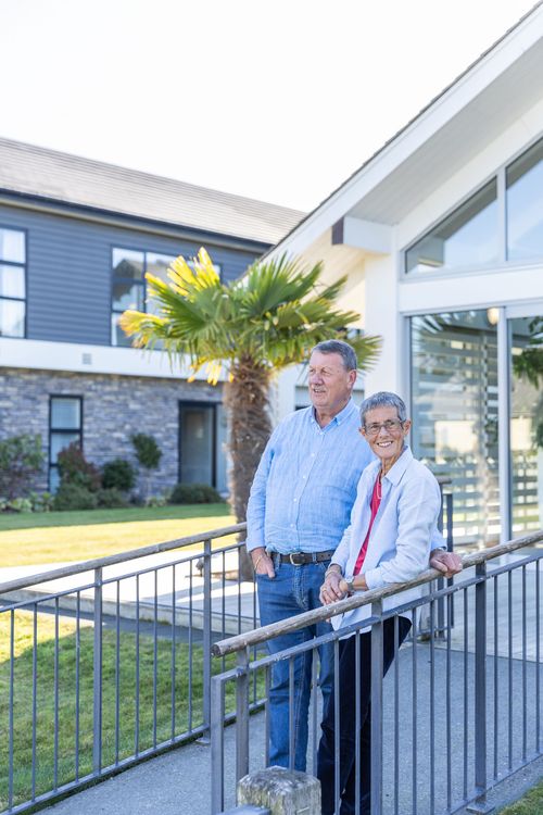 Residents enjoying sunny day outside the lodge