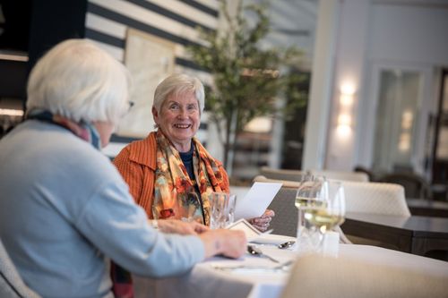 Residents dining at village restaurant