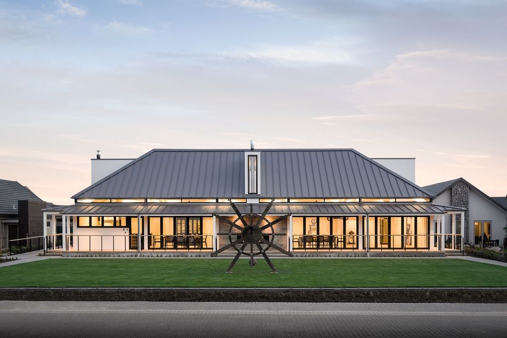 Village clubhouse exterior at sunset