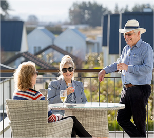 Residents enjoying wine outdoors