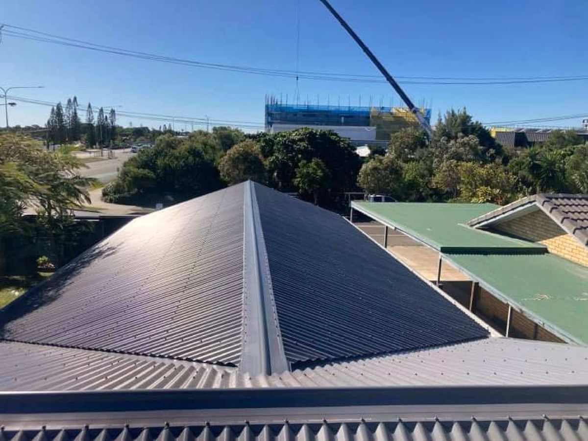 A Close Up Of The Roof Of A Building With A Blue Sky In The Background — Coastal Roof & Gutter Services In Coolum Beach, QLD