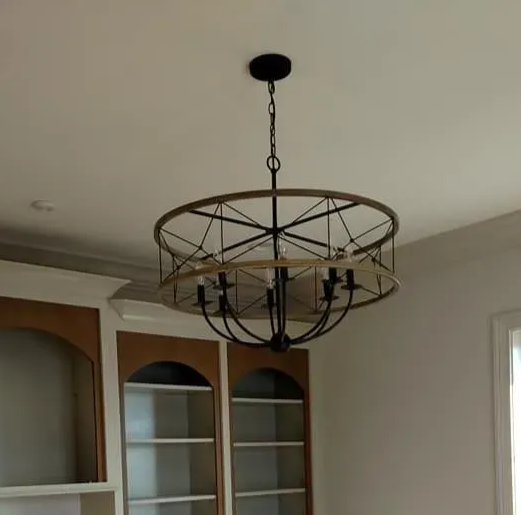Warm-lit ceiling with rows of recessed lights and textured panels