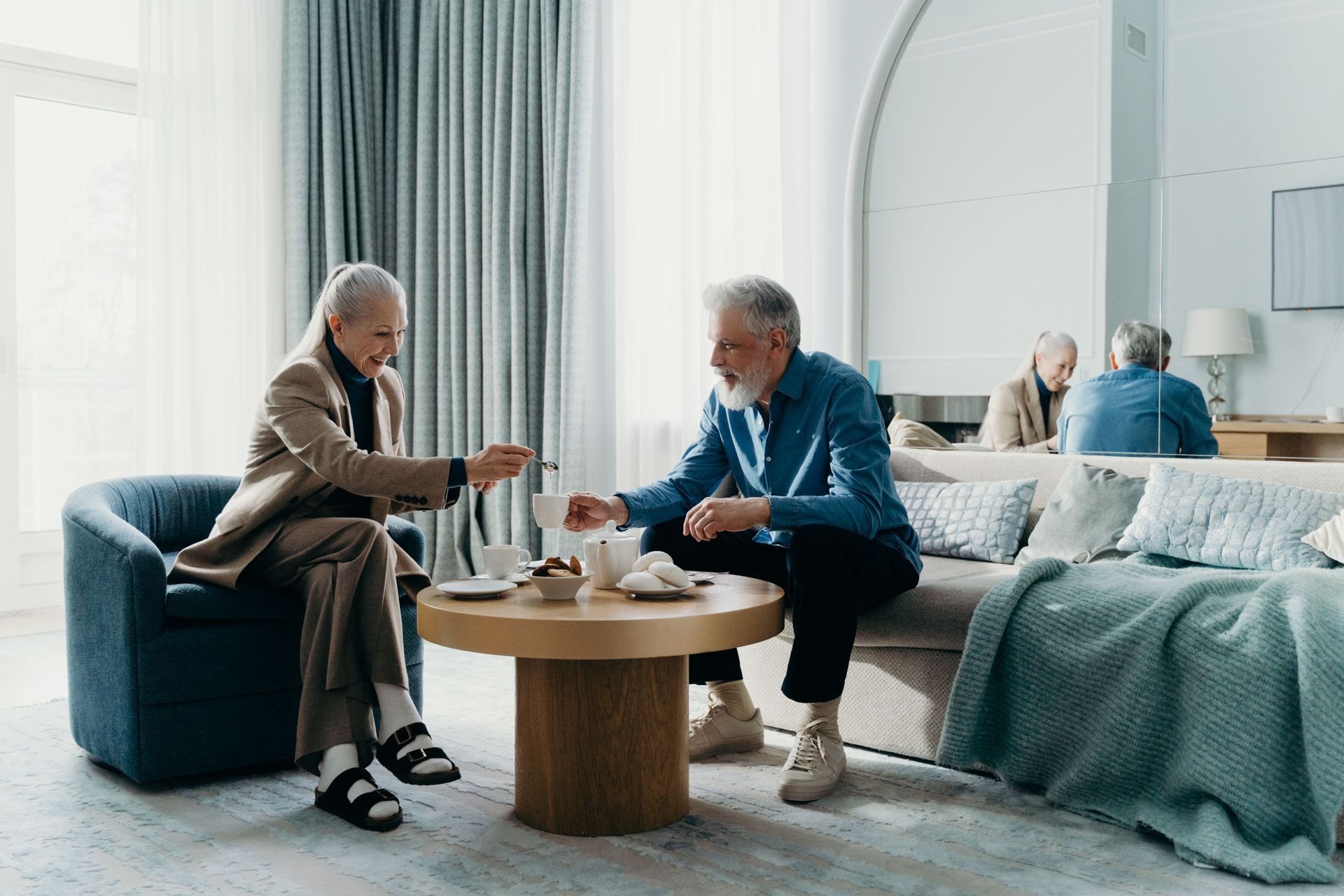 Elderly Couple Chatting Over Coffee