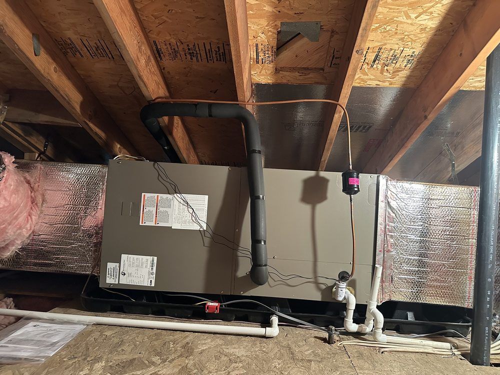 Tip of the Spear HVAC | an air conditioner is installed in the attic of a house.