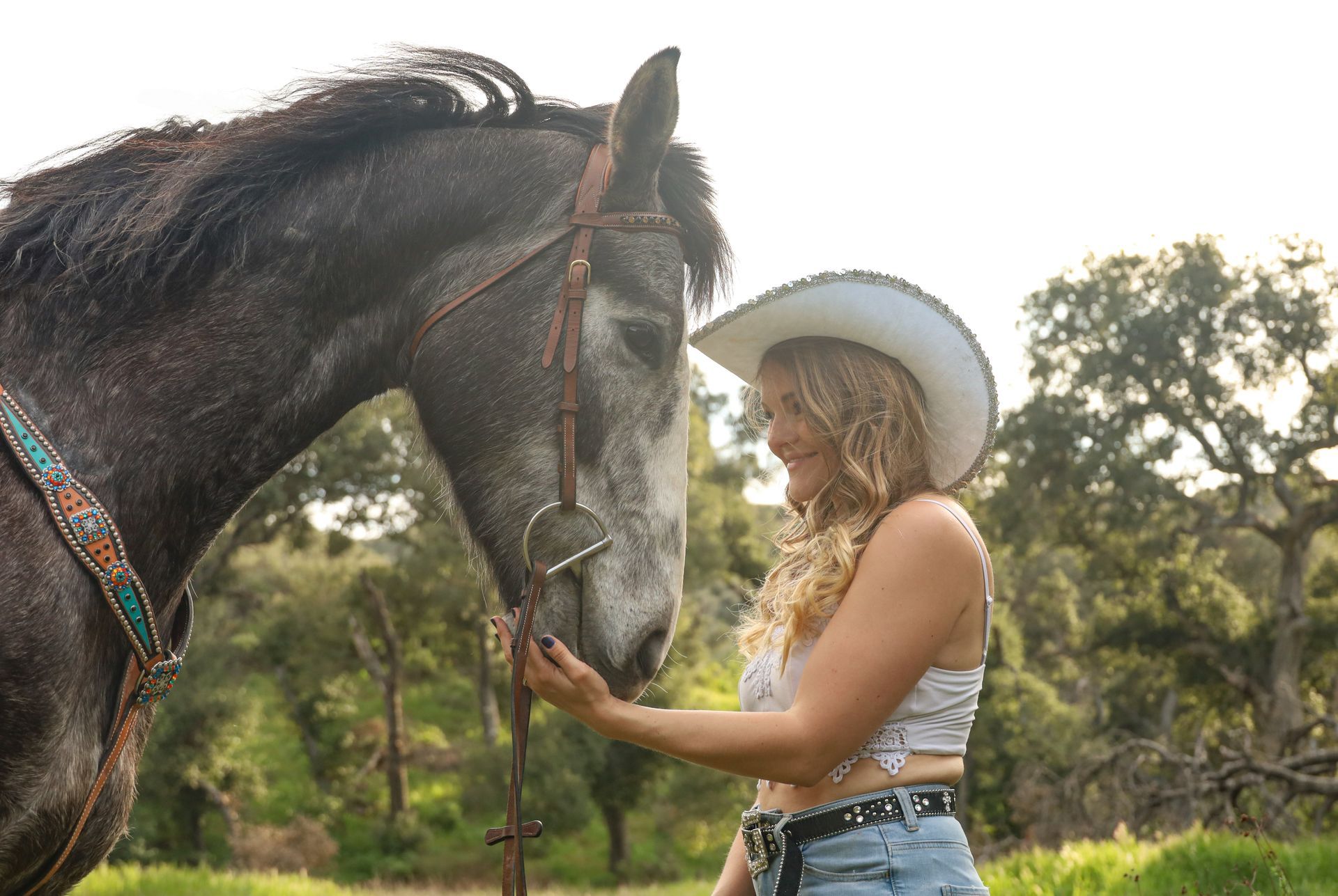 cowgirl with horse in forest