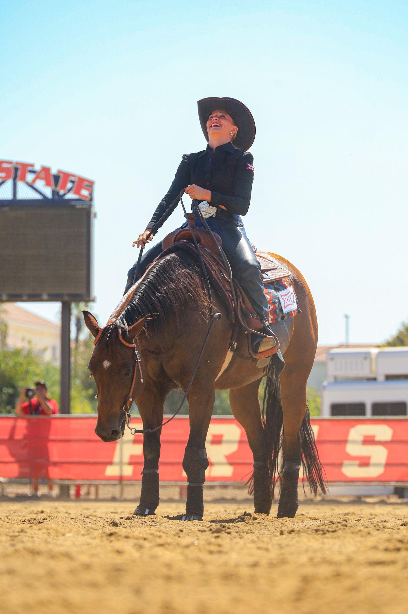 western girl smiling on horse