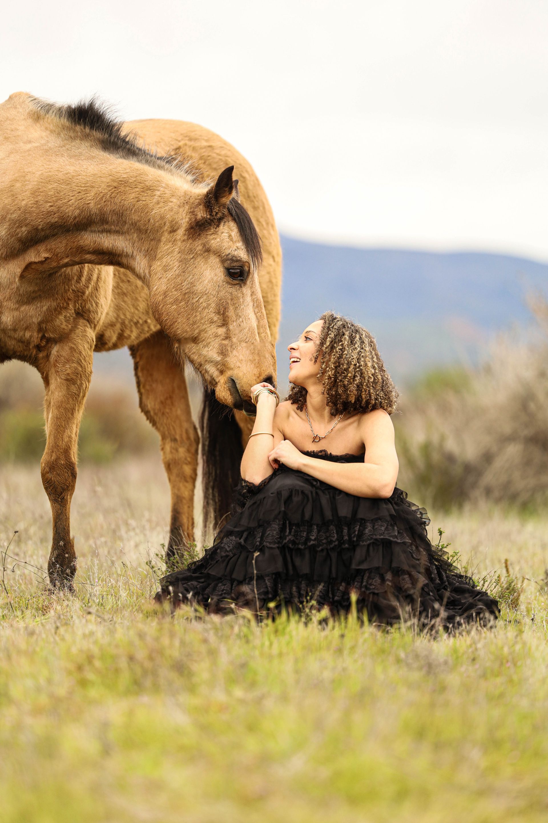 girl smiling at horse 
