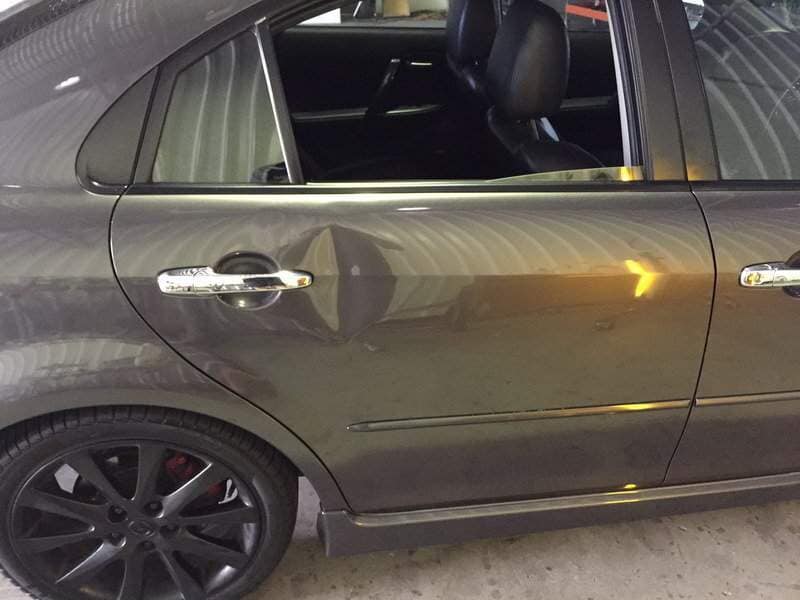 sideview of a gray car(before) — Dent Magic in Coffs Harbour, NSW