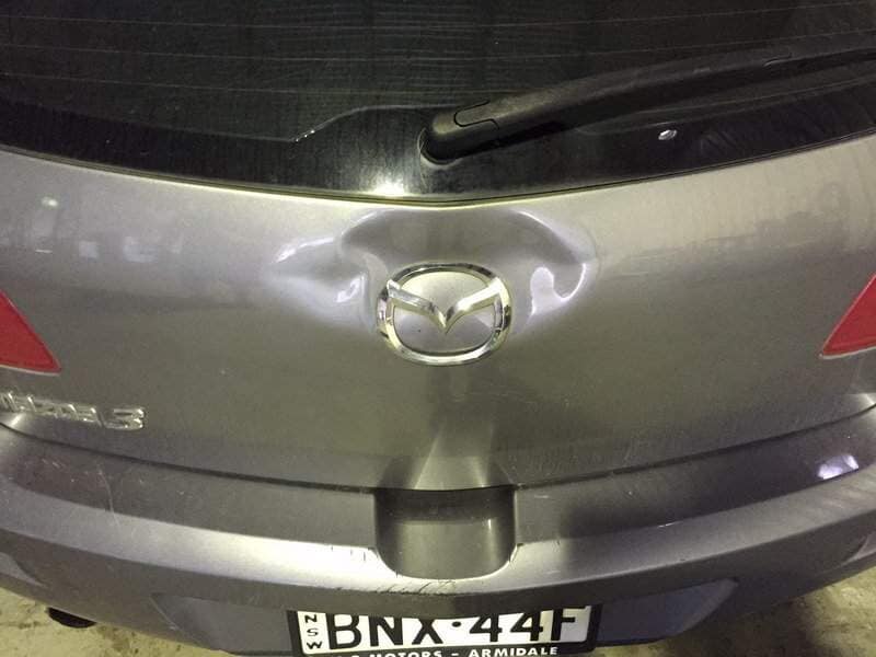 back view of a grey car(before) — Dent Magic in Coffs Harbour, NSW