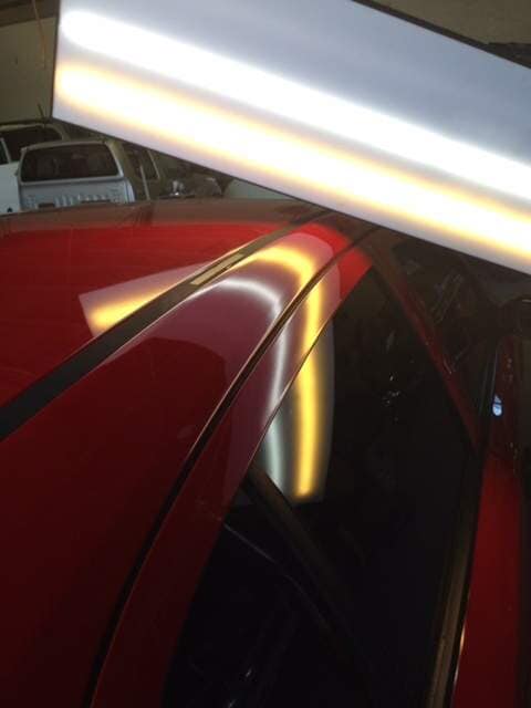 Top View Of Red Car With Paintless Dent Removal — Dent Magic in Coffs Harbour, NSW