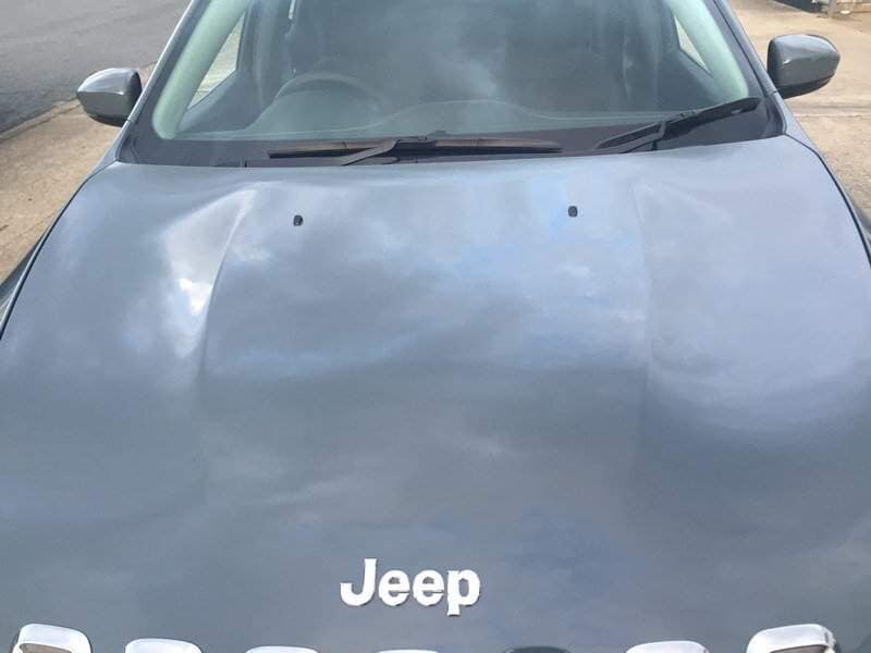 front view of a gray car(before) — Dent Magic in Coffs Harbour, NSW