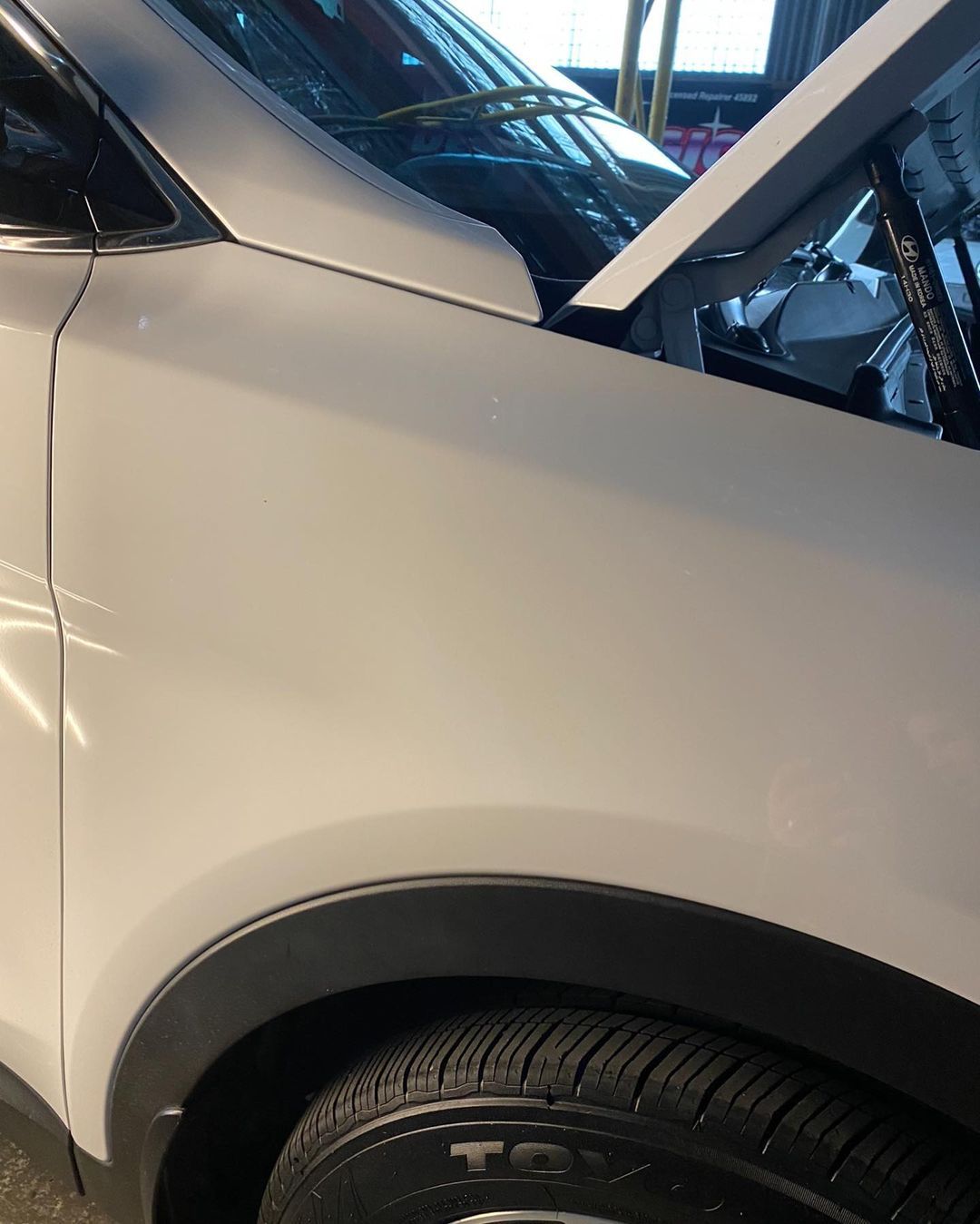 White Small SUV Front Guard After Dent Removed - Dent Repairs in Coffs Harbour