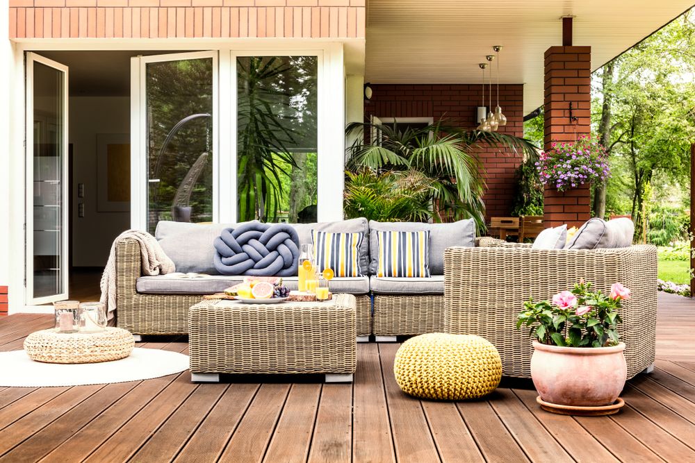 A Patio With a Couch, Chairs, Table and Potted Plants — Barling Constructions in Casino, NSW