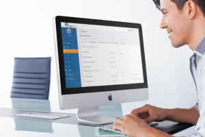 Businessman using a computer with RatesCalc on the monitor