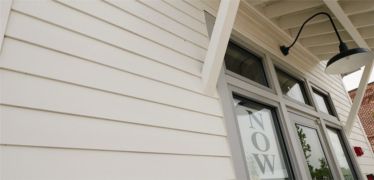 White horizontal siding and building entrance