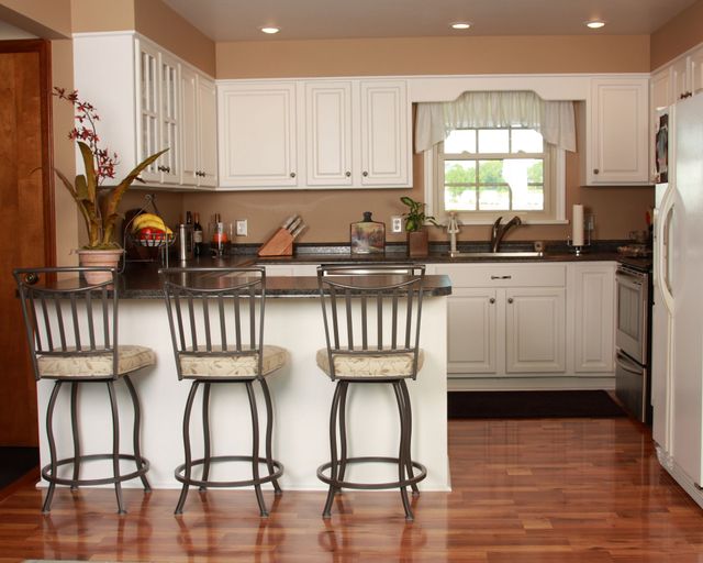 White Kitchen Remodel by Tailored Roofing and Remodeling Inc. — Project 2 project photo 2
