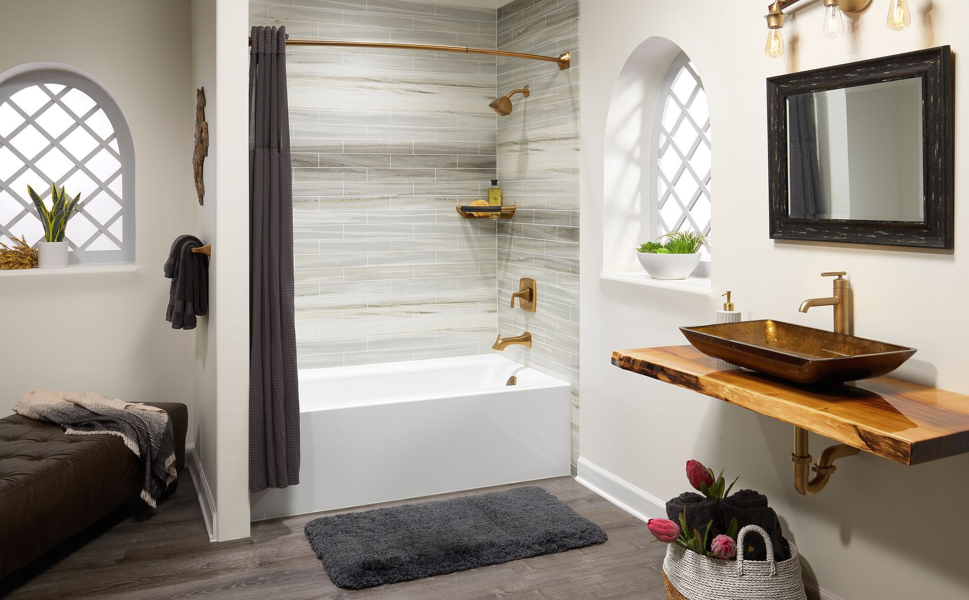 Modern bathroom with wood vanity and tiled shower.
