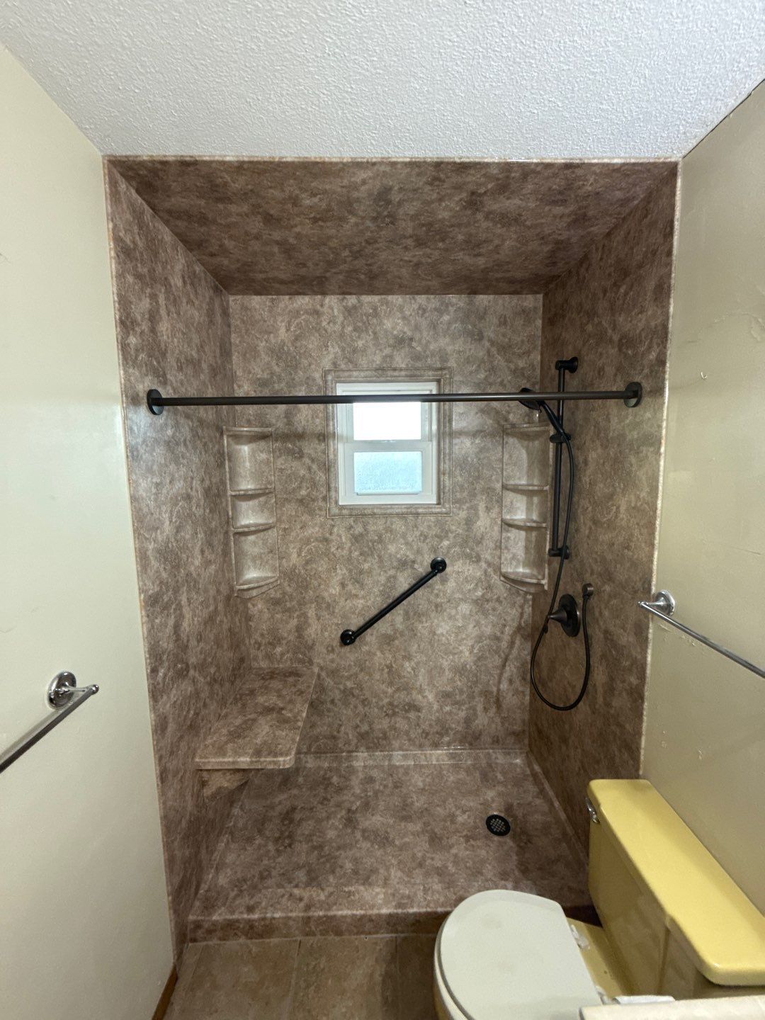 A newly installed acrylic walk-in shower system