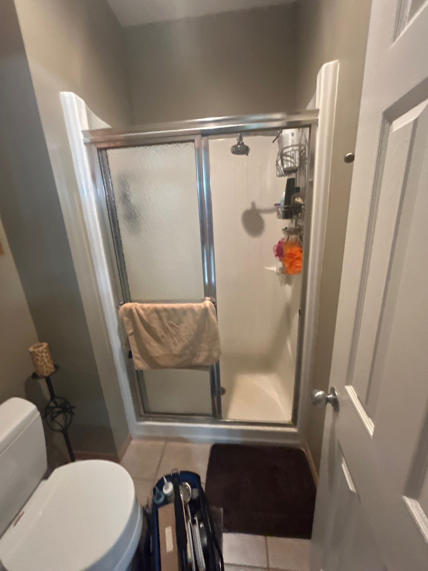 Small bathroom with a stand-up shower stall