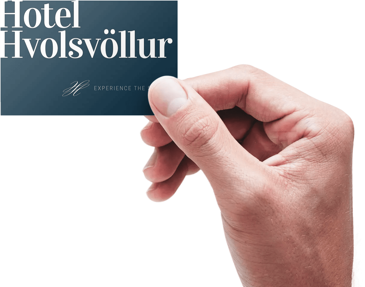 A person is holding a hotel card in their hand