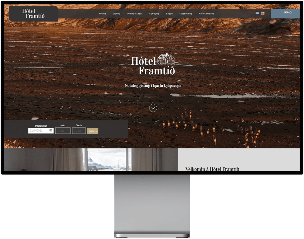 A computer monitor displays a hotel website