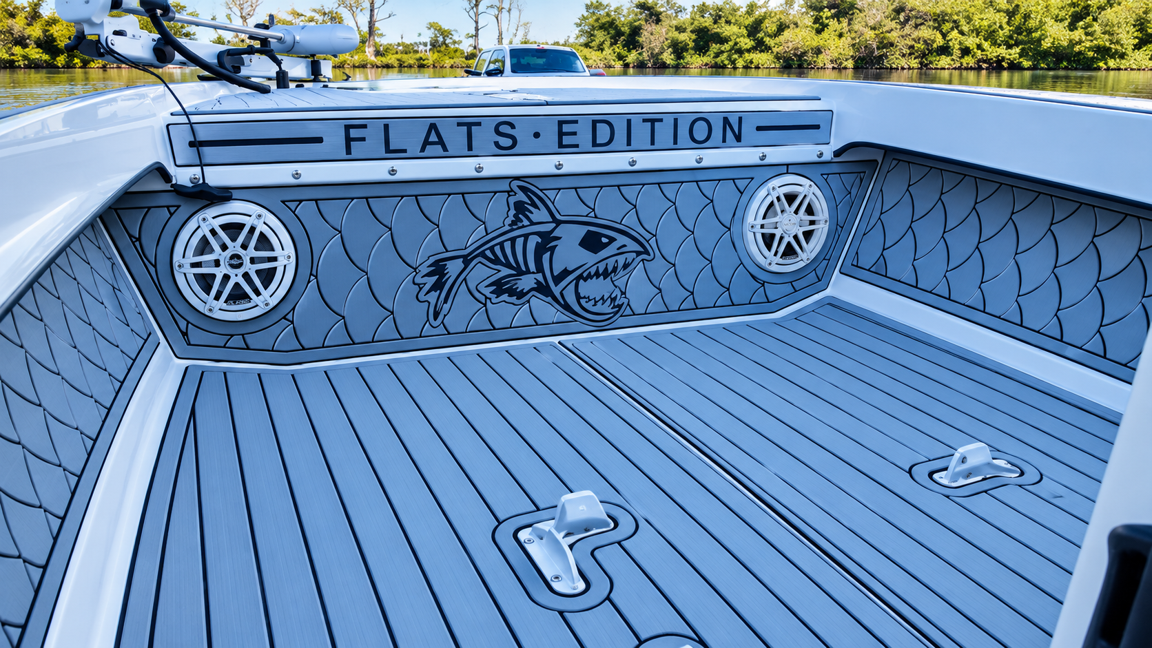 Blue boat deck with “FLATS EDITION” lettering and built-in speakers at the stern.