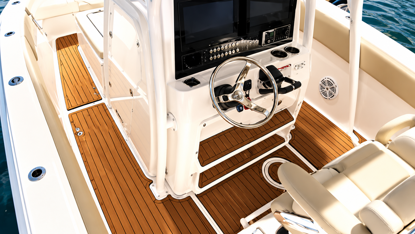 Helm of a boat with wheel, monitor, and white seating on a teak deck