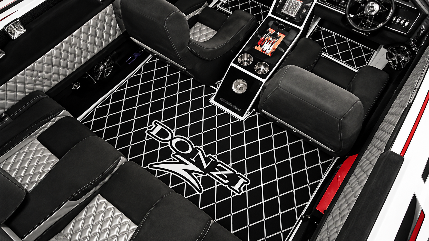 Black-and-white car interior with diamond quilted upholstery and a center console