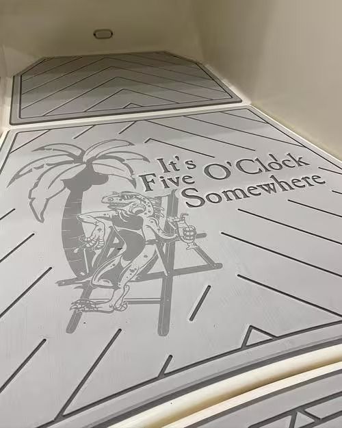 Floor art with a pirate illustration and the words “It’s Five O’Clock Somewhere” in a hallway