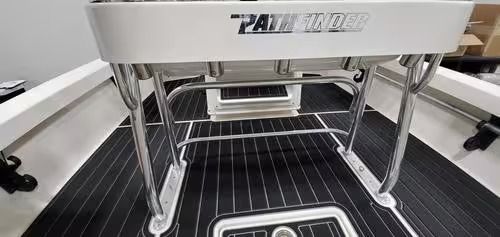 White Power-Pole Pro2 mount above a black boat deck with silver railings and mounted hardware