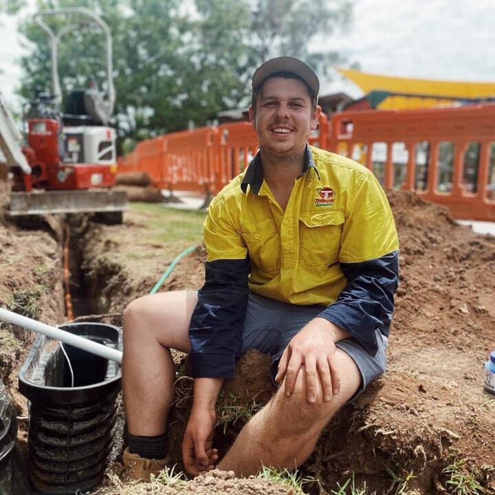 Worker Smiling Onsite — Security Systems in Guyra NSW