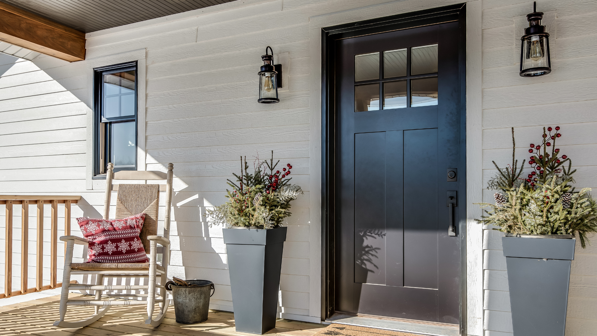 There is a rocking chair on the porch of a house.